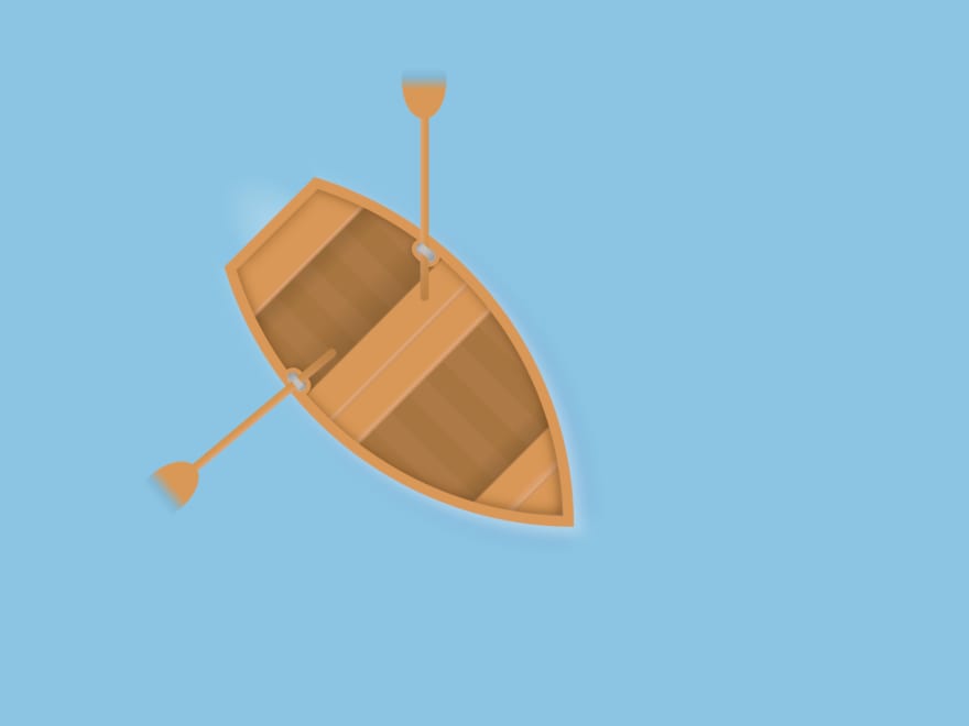 Wooden boat with two oars floating on the water