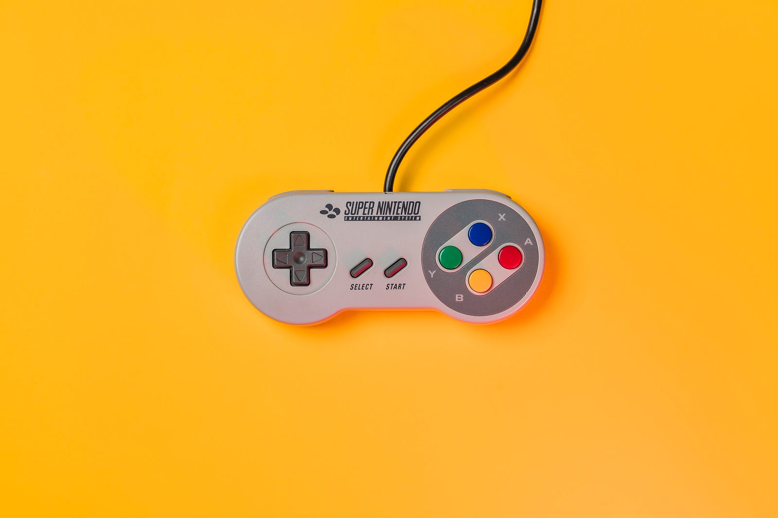 A SNES controller (Photo by Patrick on Unsplash)
