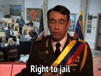 Animated GIF from the tv show Parks and Recreation, showing a man dressed in military attire saying "right to jail!"