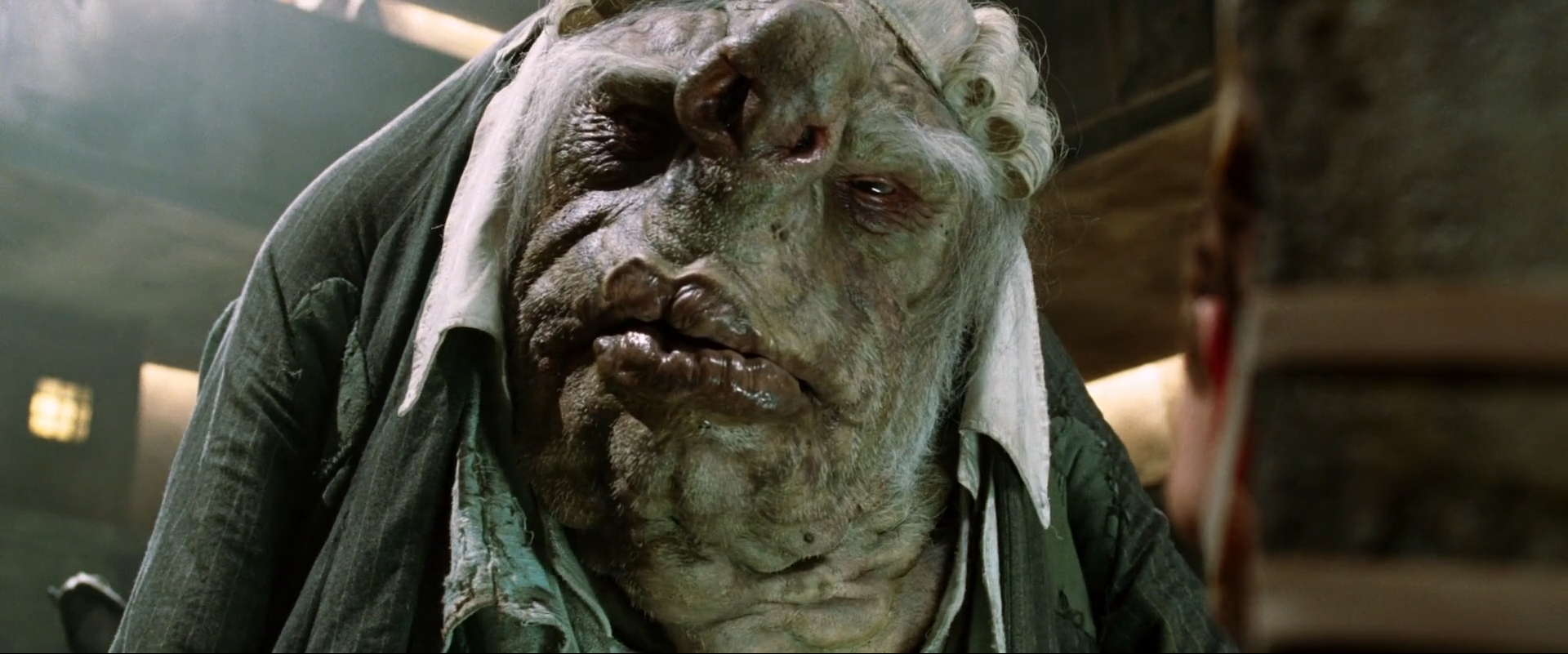 Screenshot from the movie The HitchHicker's Guide to the Galaxy, showing a Vogon; a really ugly alien race known for their love of bureaucracy and their poor poetry skills