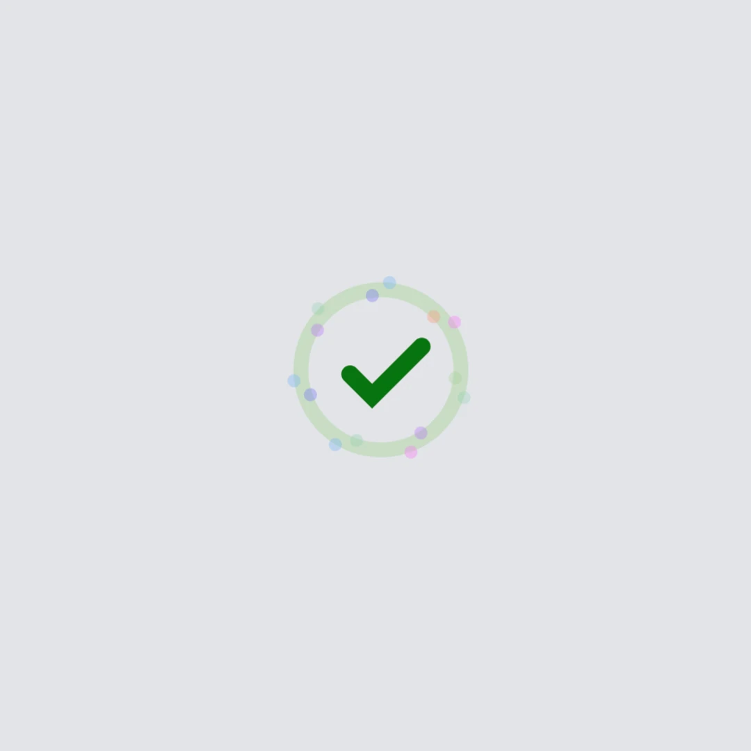 Screenshot of a loader that has turned into a green checkmark and has circles of colors around it